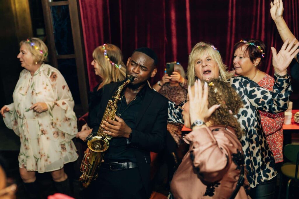 Temitope Oladipupo: performing at a lively party.